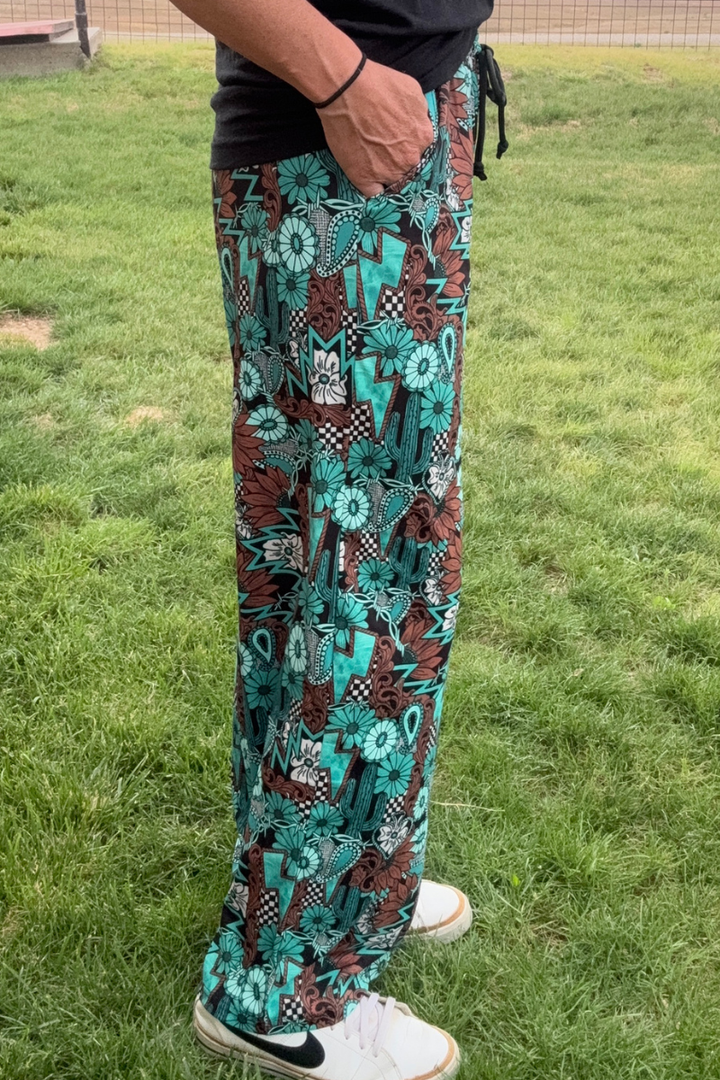 Tattoos In Turquoise Pants by Sterling Kreek