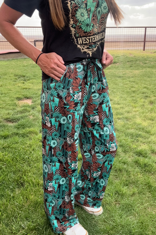 Tattoos In Turquoise Pants by Sterling Kreek