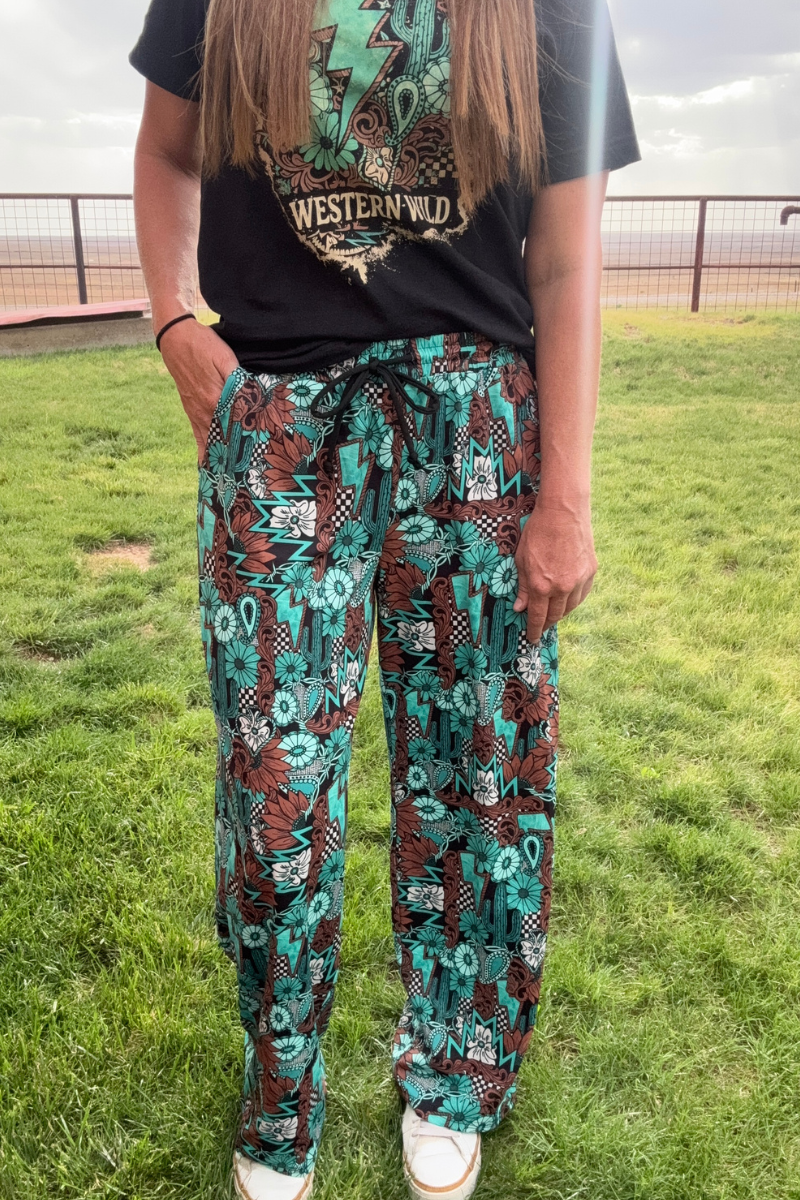 Tattoos In Turquoise Pants by Sterling Kreek